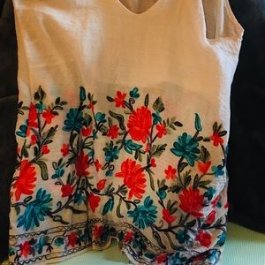 Hand embroidered spaghetti strap sleeveless blouse with built in front slip.